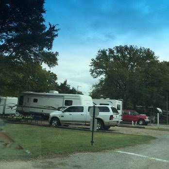 Shaded RV campsites with tall trees at Pinch Pond Family Campground near Hershey, PA