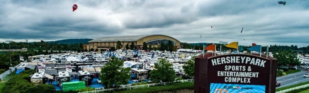 Aerial panoramic view of hundreds of RVs parked outdoors at the Hersheypark Sports & Entertainment Complex during America's Largest RV Show.