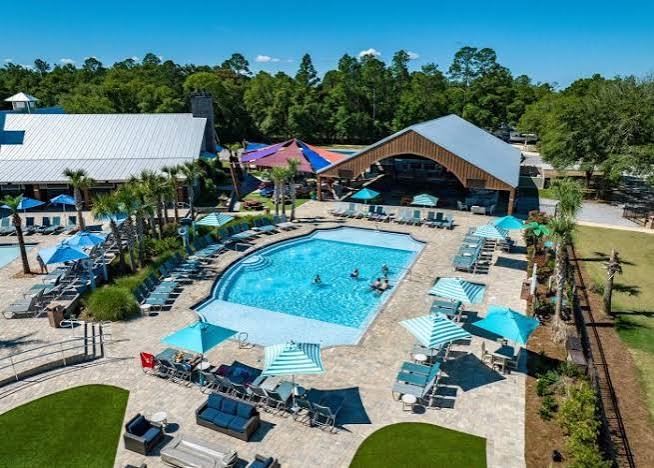 Aerial view of Splash RV Resort pool area, lazy river, and water slides in Milton, Florida