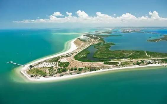 Aerial view of Fort De Soto Park Campground key with waterfront campsites surrounded by blue waters in Tierra Verde, Florida