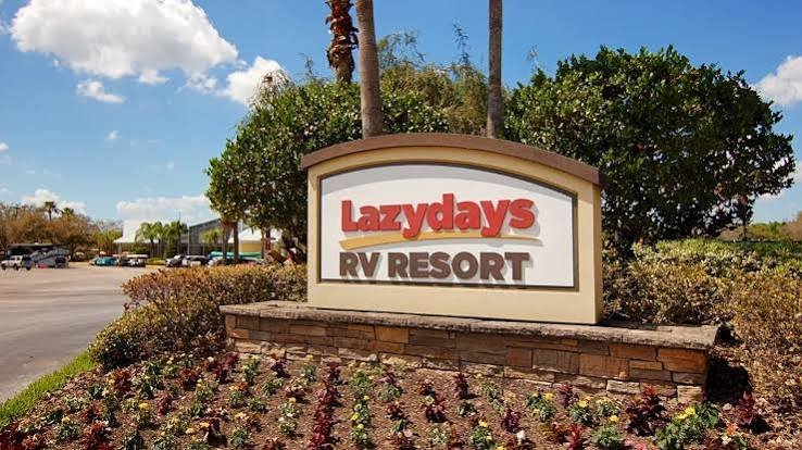 Lazydays RV Resort entrance sign surrounded by palm trees in Tampa, Florida